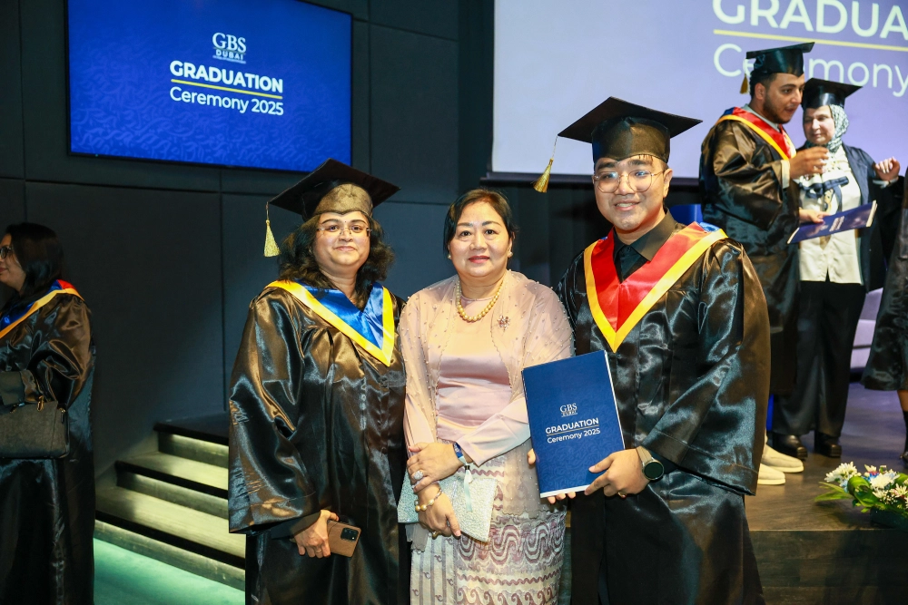A graduate celebrating with guests
