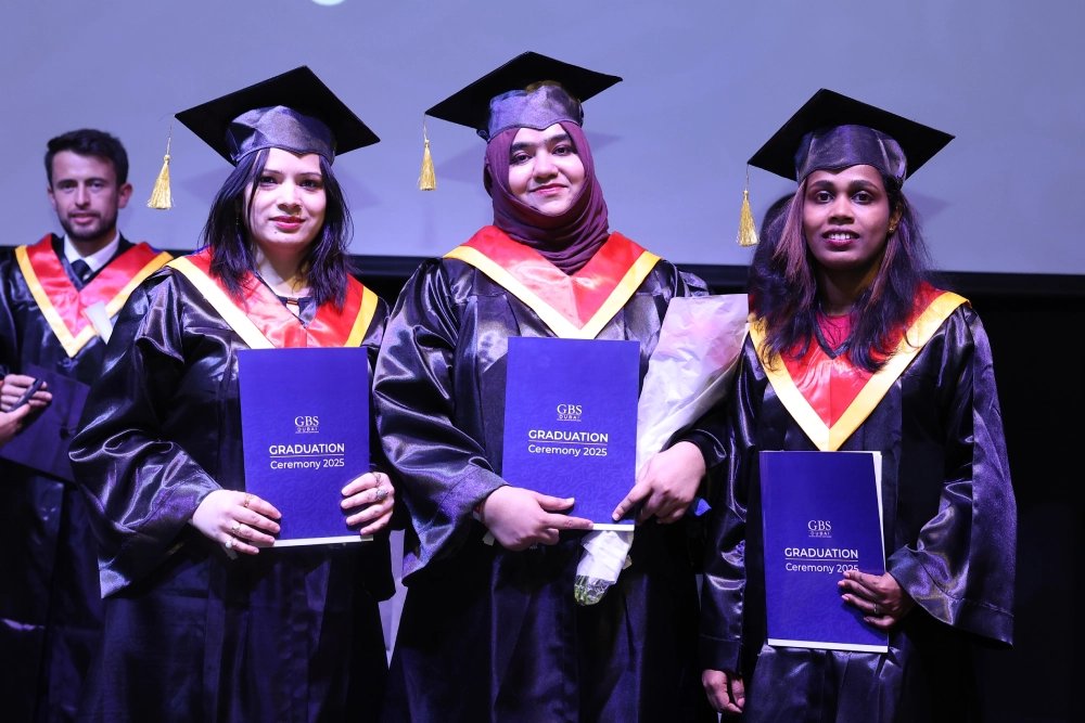 Graduates celebrating together with their certificates
