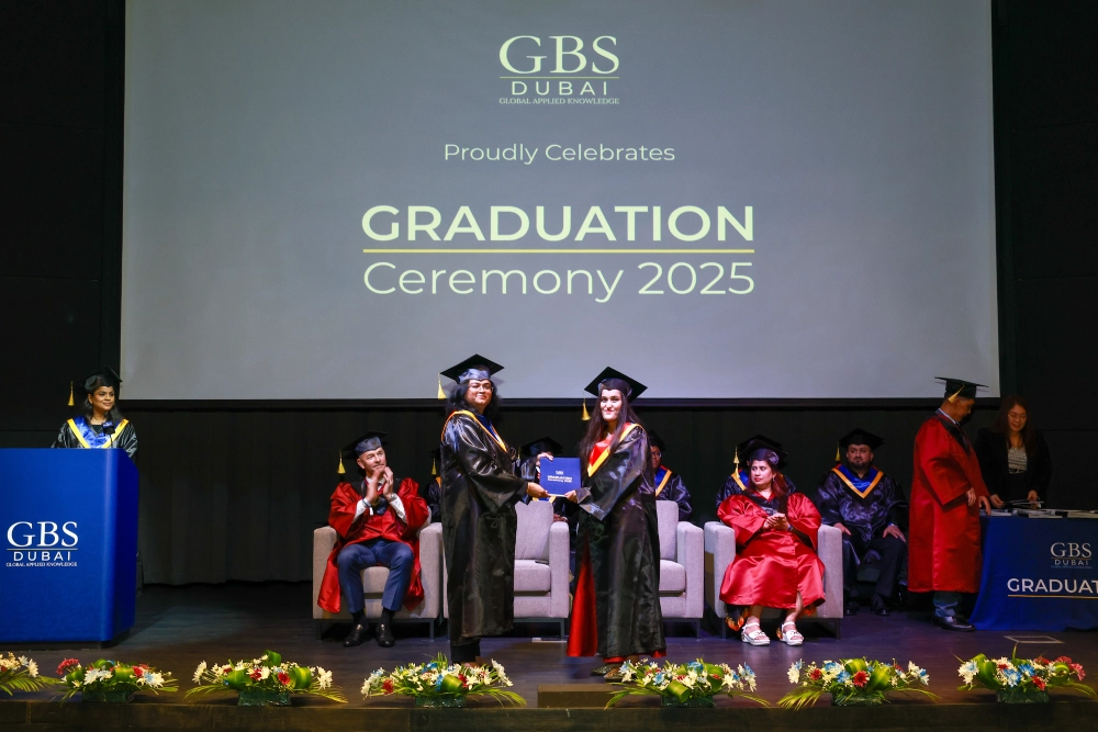 A graduate being recognised on the ceremony stage