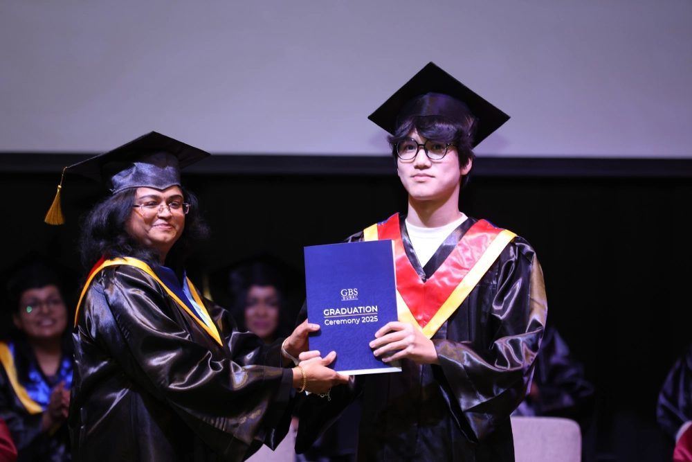 Certificate presentation at the graduation ceremony