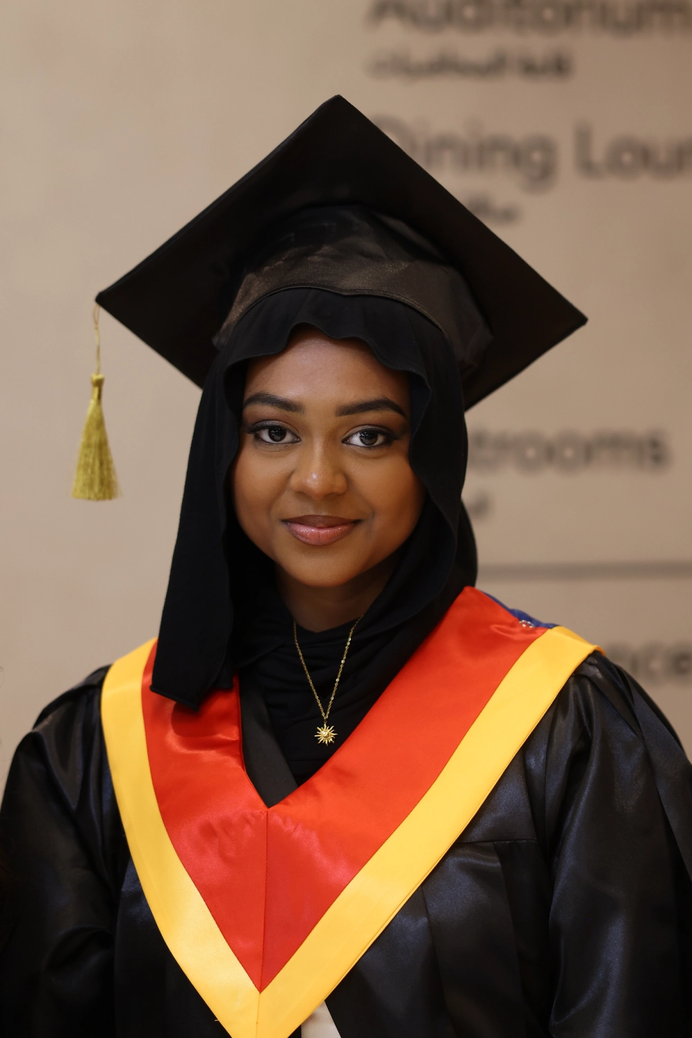 Portrait of a graduate wearing a cap and gown
